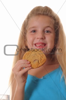 shot of a happy child with cookie