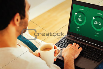 Composite image of man using laptop