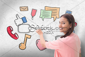 Composite image of pretty brunette smiling and writing