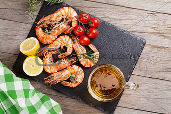Grilled shrimps and beer mug