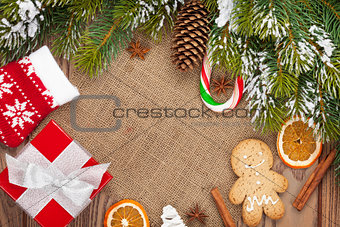 Christmas food, decor and gift box with snow fir tree background