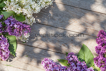 Colorful lilac flowers on garden table