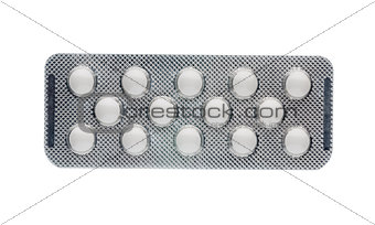 White tablet in medication blister pack