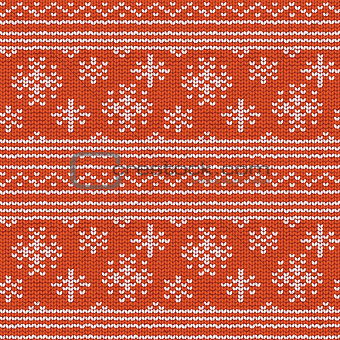 Seamless hand-knitted pattern with red and white threads.