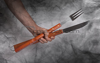 Hand hold of BBQ equipment