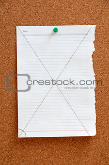 Blank piece paper pinned into corkboard