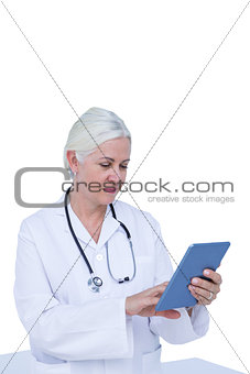 doctor standing with tablet pc
