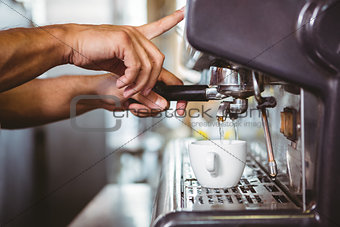happy worker making coffee