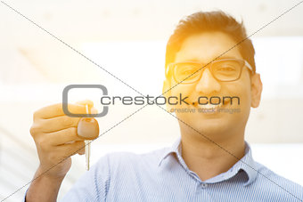 Man hand holding new car key