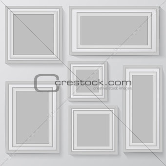 Set of white photo frames on grey background