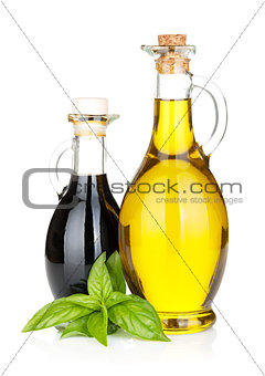 Olive oil and vinegar bottles with basil