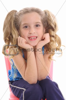 shot of happy little girl with curly pig tails