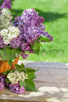 Colorful lilac flowers in basket