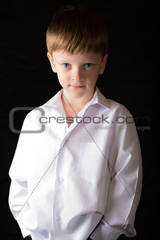 Portrait of the boy on a black background