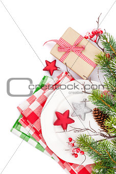 Christmas table setting with gift box and fir tree