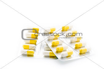 Yellow capsules pill blister pack