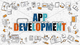 App Development on White Brick Wall.