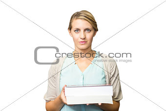 Composite image of teacher holding books