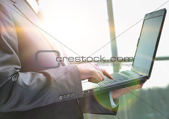 Businessman using laptop in the office
