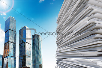 Skyscraper with pile of paper