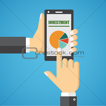 Hand holding smart phone with analyzing graph.