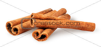 Three cinnamon sticks lying cross