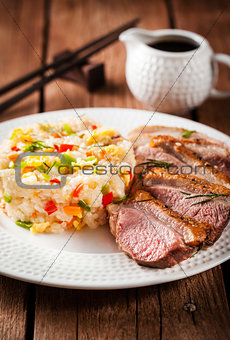Fried duck  and rice with vegetables and eggs