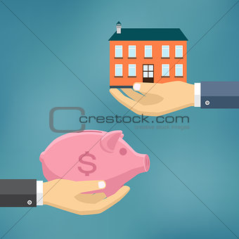 Hand with piggybank and hand with house.