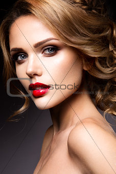 Close-up portrait of beautiful woman with bright make-up