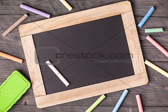 Blackboard sponge and chalks