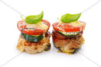 Fried mincemeat baked chops with vegetables and cheese.