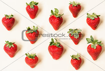 Strawberries on light yellow background