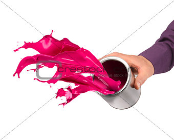 Hand throwing paint from can