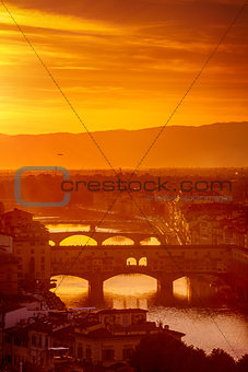 Gold sunset at bridge Ponte Vecchio in Florence