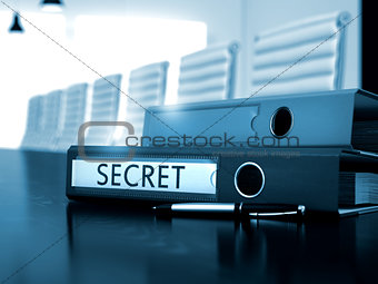 Secret on File Folder. Blurred Image.