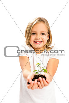 Cute girl showing a plant