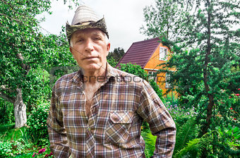 Farmer on the background of a summer garden