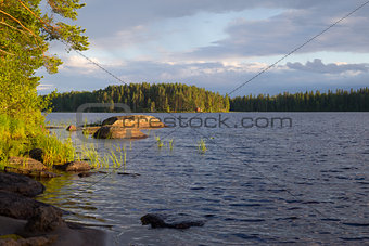 Finnish lake with stones in the water.