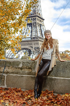 tourist woman on embankment near Eiffel tower in Paris, France