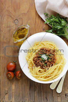 traditional pasta with Bolognese sauce with parmesan and herbs