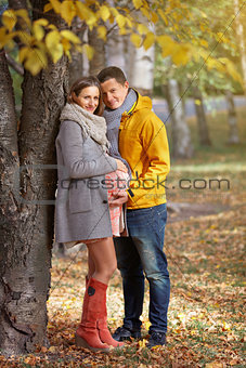 Pregnant woman in the autumn