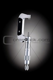 Open micrometer side view isolated on black background