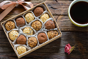 Chocolate truffles and cup of black coffee