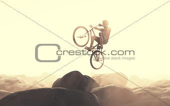 Cyclist climbing on a rock.