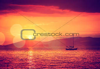 Sailing Yacht in Calm Bay. Sunset Seascape.