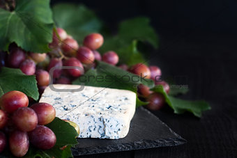 Blue cheese with grape background