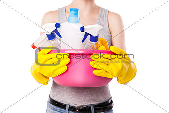 Unknown female holding cleaning substance.