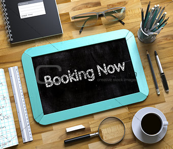 Booking Now Concept on Small Chalkboard. 3D.