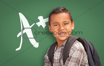 Hispanic Boy Up in Front of A+ Written on Chalk Board
