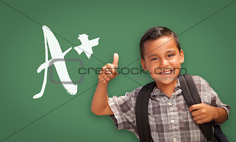 Hispanic Boy with Thumbs Up in Front of A+ Written on Chalk Boar